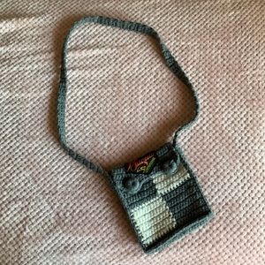 Gray/white crossover bag. Written “Baguio city” on top.